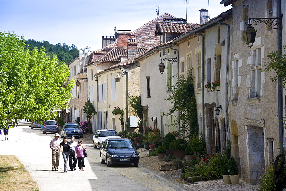 Tourists in historic town of St Jean de Cole, France