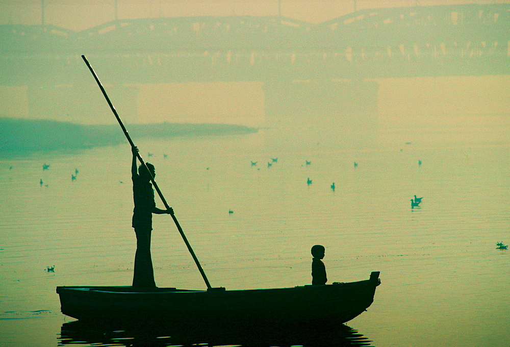 Man and child on ferry, Delhi, India