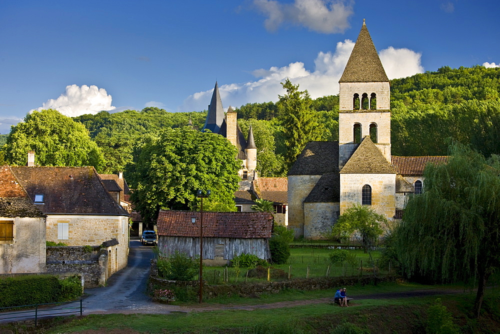 Courting couple in the village of St Leon sur Vezere in the Dordogne, France