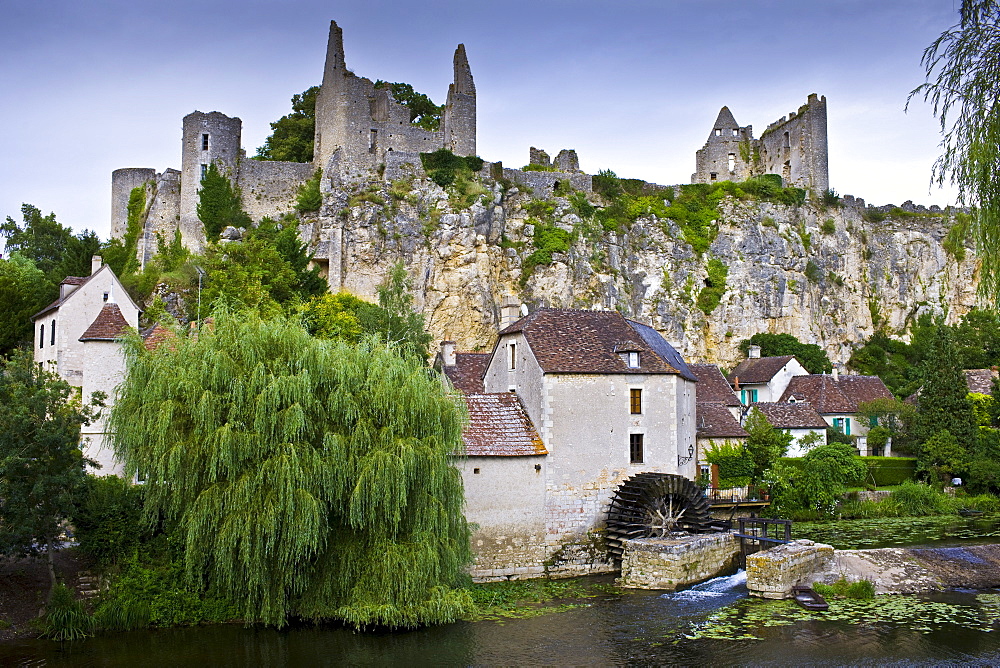 Traditional French houses and Chateau Guichard ruins at Angles Sur L'Anglin medieval village, Vienne, near Poitiers, France