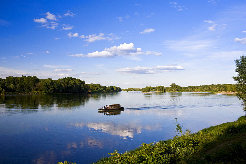 Wooden motor boat on the River Loire at Candes St Martin, Loire Valley, France