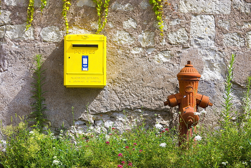 Traditional water hydrant and letter box at Parnay in the Loire Valley, France