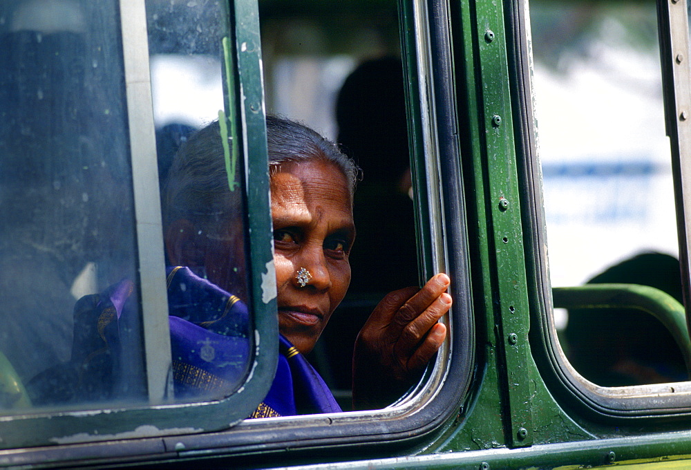 Woman bus passenger, Calcutta, India