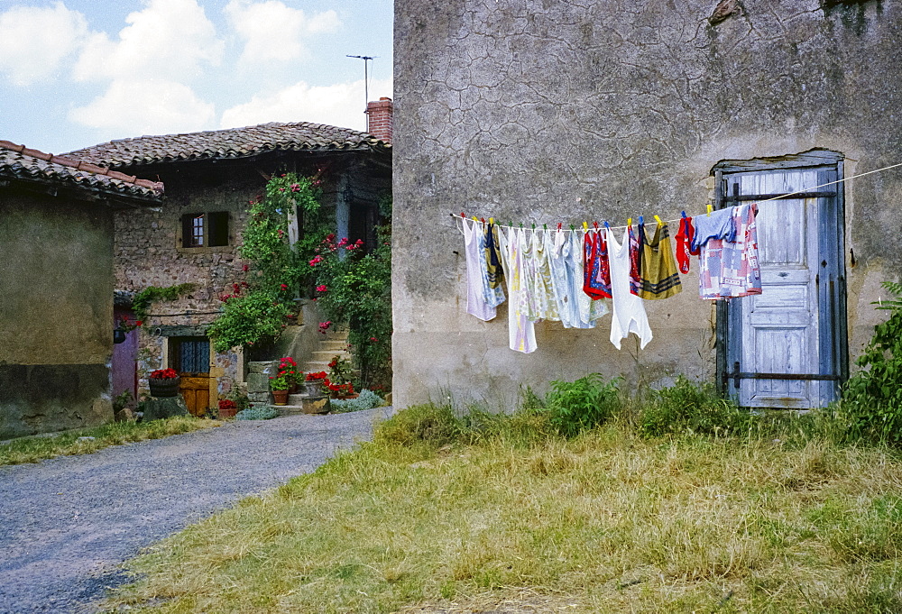 Domestic scene of laundry on washing line in village of Chenas, France