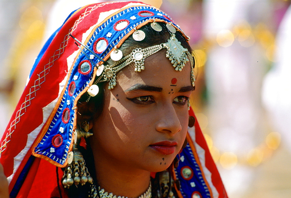 Young pretty girl in national costume and jewels at a festival in Calcutta, India