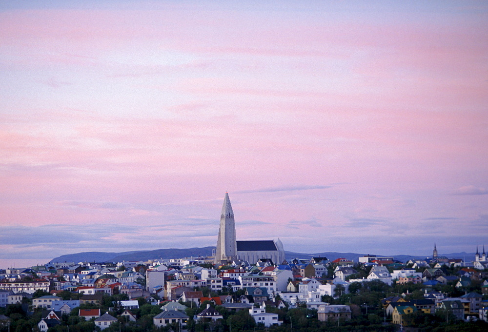 Midnight in City of Reykjavik in far north where tourists often travel to view the Northern Lights phenomenon in the sky, Iceland