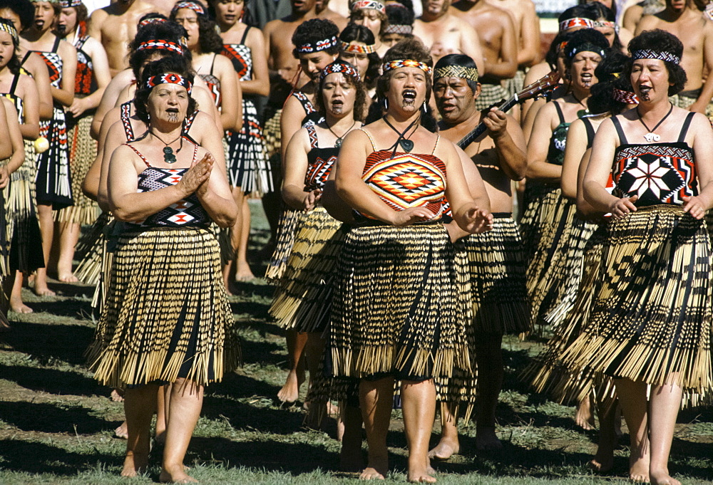 Maori women dancing at tribal gathering at the Marae in New Zealand