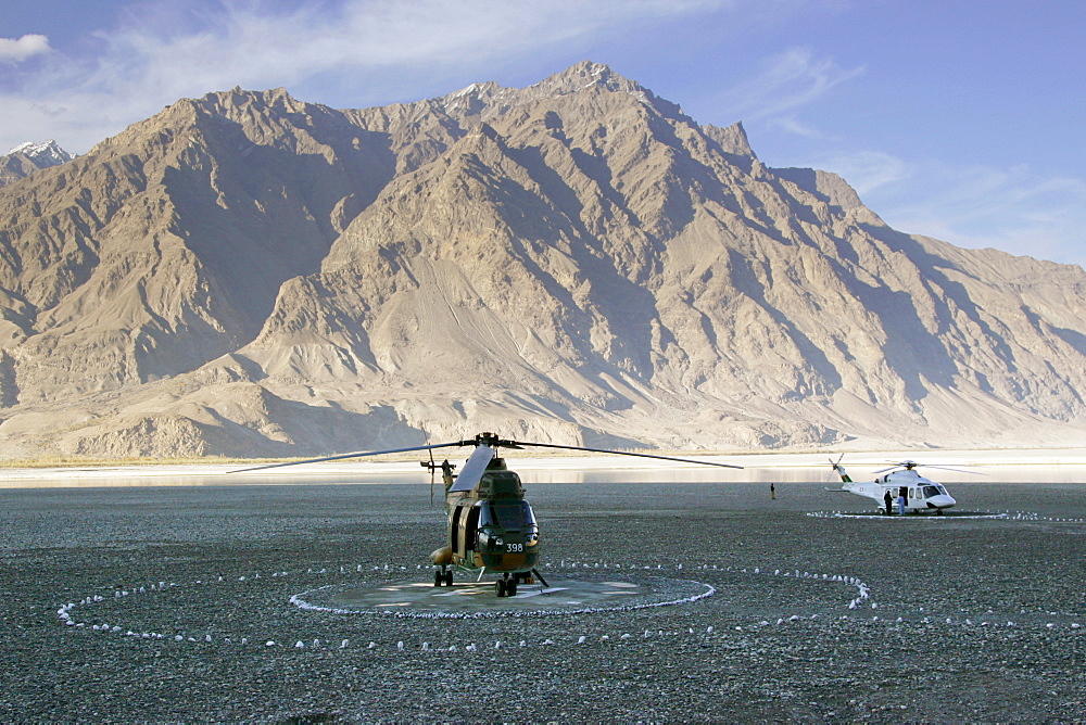 Helicopters on landing pad in Hunza region of Karokoram Mountains, Pakistan