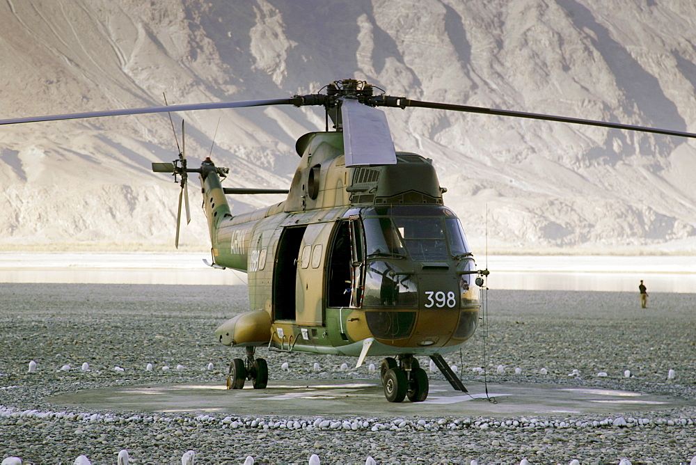 Military Helicopter on landing pad in Hunza region of Karokoram Mountains, Pakistan