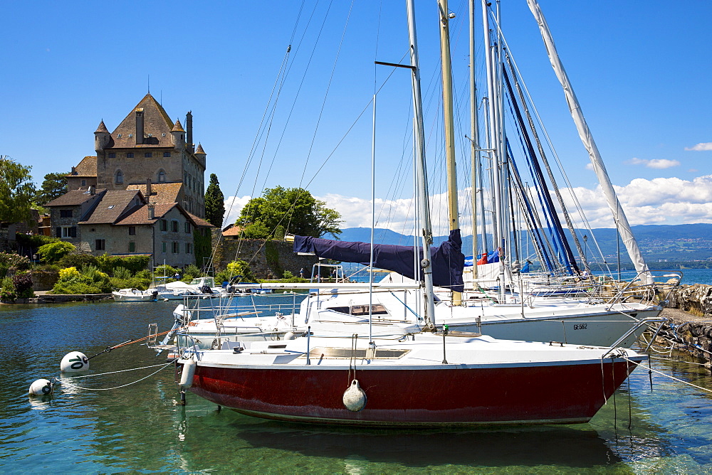 Yachts by the 12th century medieval castle in the old port of Yvoire on Lac Leman (Lake Geneva), Rhone-Alpes, France, Europe