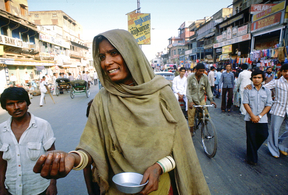 A begga r in the street in Delhi,  India