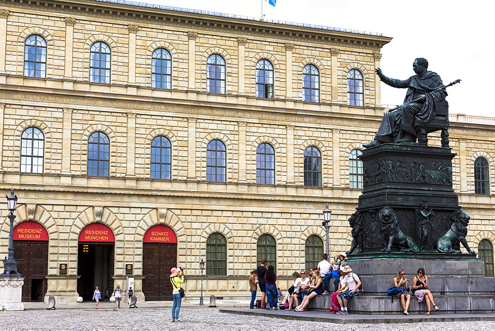 Tourist photographs statue of Maximillian Iosepho, King of Bavaria by the Residenz in Munich, Bavaria, Germany, Europe