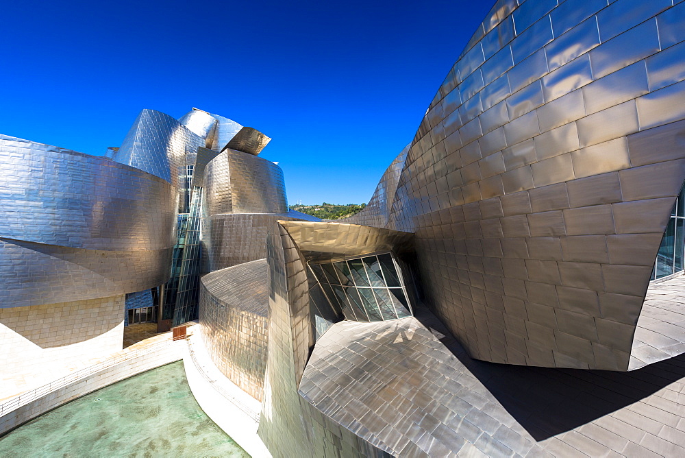 Architect Frank Gehry's Guggenheim Museum futuristic architectural design in titanium and glass at Bilbao, Basque country, Euskadi, Spain, Europe