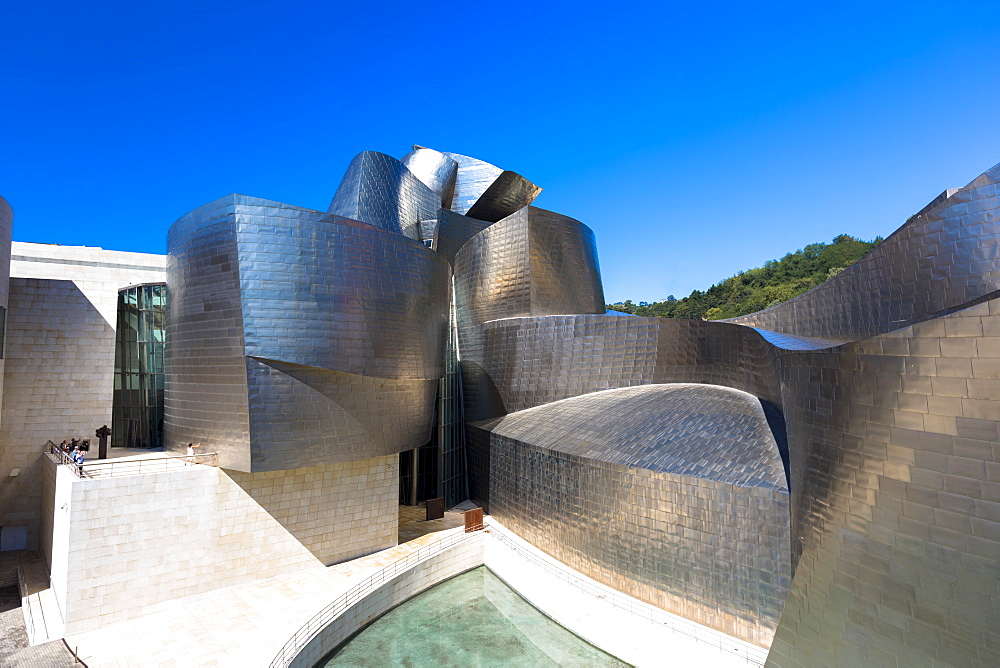 Architect Frank Gehry's Guggenheim Museum futuristic architectural design in titanium and glass at Bilbao, Basque country, Euskadi, Spain, Europe