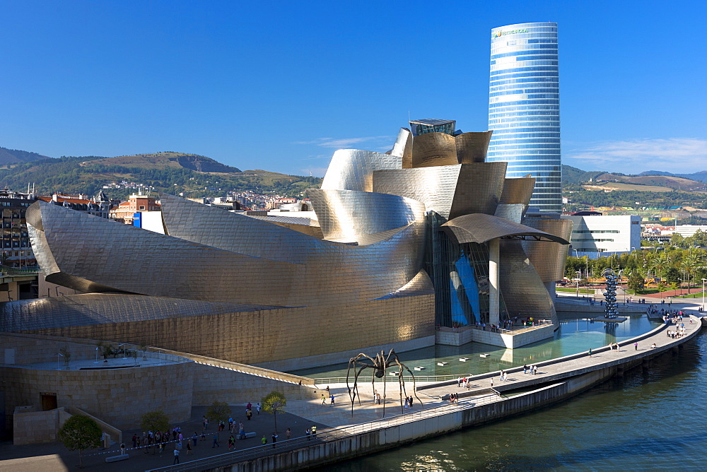 Frank Gehry's Guggenheim Museum, The Spider sculpture, Iberdrola Tower and River Nervion at Bilbao, Euskadi, Spain, Europe