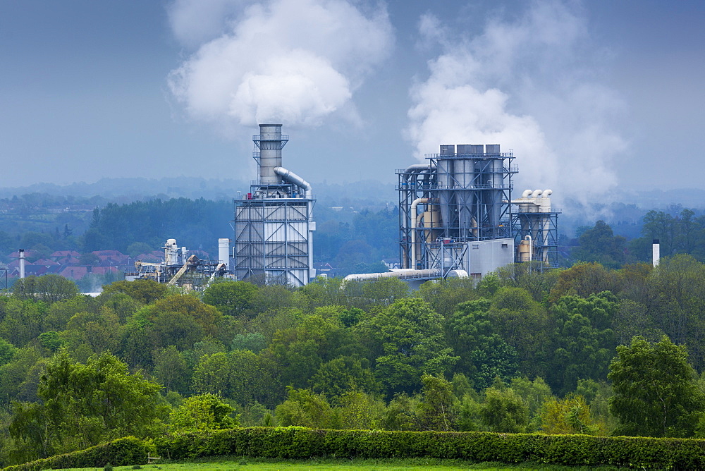 Steaming smoke stacks at Kronospan Factory making wood based panels, chipboard and MDF at Chirk in Wrexham, Wales, United Kingdom, Europe