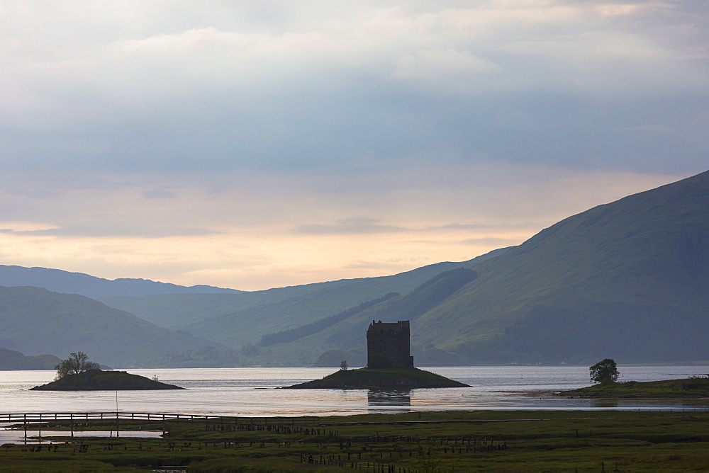 Stalker Castle, a highland fortress, on Loch Linnhe at sunset, Appin, Argyll, in the Highlands of Scotland, United Kingdom, Europe