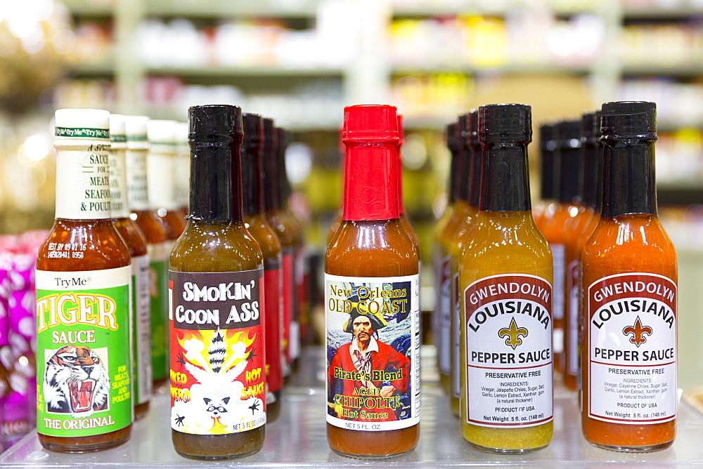 Bottles of Cajun spicy sauces - Chipolte, Pepper - at Magnolia Sugar and Spice Hot Sauce Bar, French Quarter, New Orleans, USA