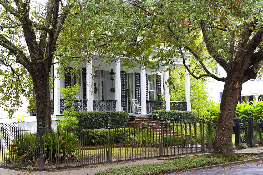 Traditional grand mansion house with columns in the Garden District of New Orleans, Louisiana, United States of America