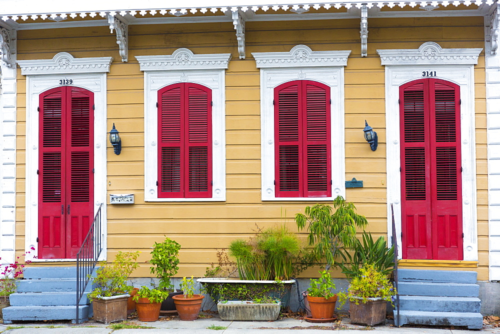 Traditional bright colour clapboard creole cottage home in Faubourg Marigny historic district  of New Orleans, USA