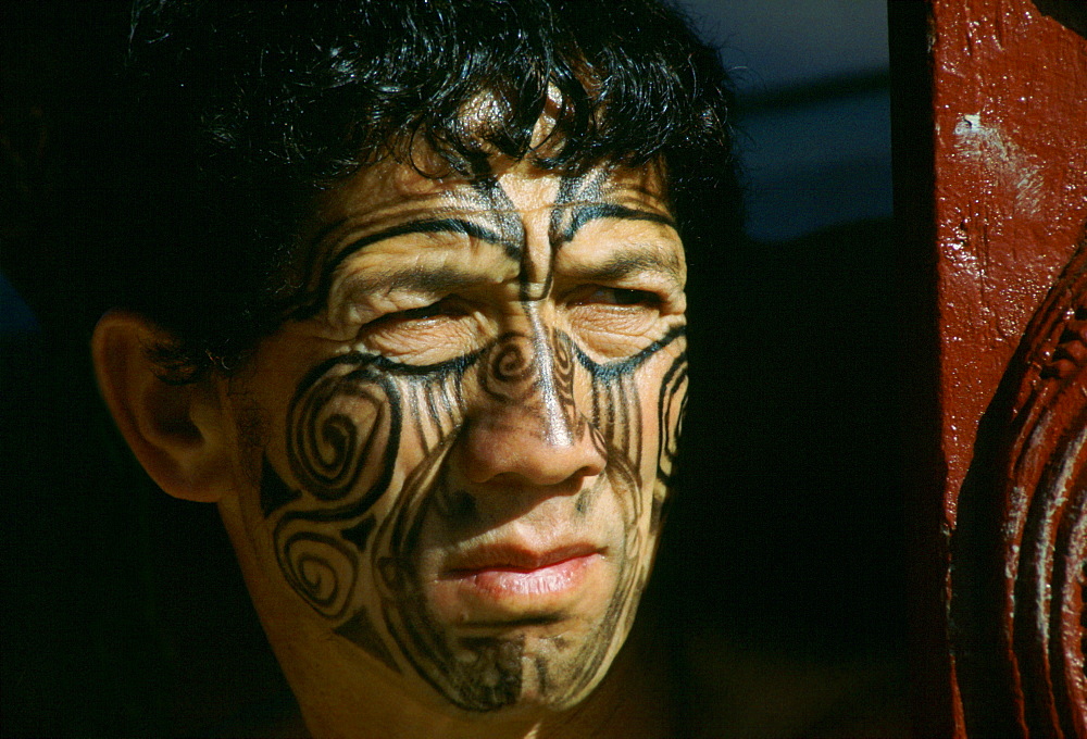 Maori man with painted face in New Zealand