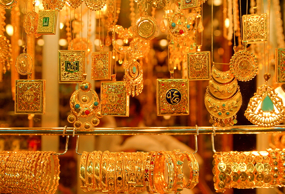 Gold jewels - necklaces, bangles, bracelets and pendants on display at the Gold Souk in Kuwait City, Kuwait