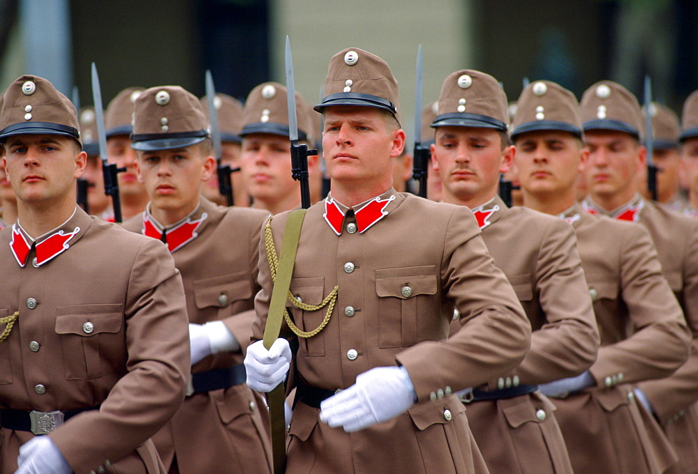 Hungarian Soldiers in their beige and red uniforms marching in Budapest, Hungary