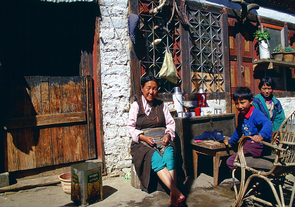 Woman and children at home in Paro, Bhutan