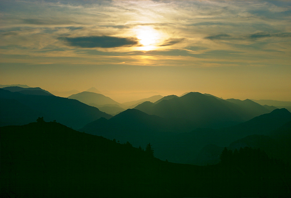 The sun setting over theSalzkammergut mountain range, Austria