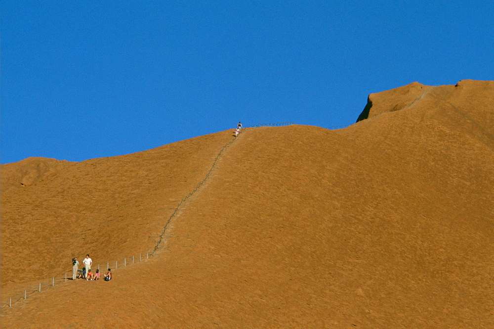 Tourists visiting Ayers Rock in Australia