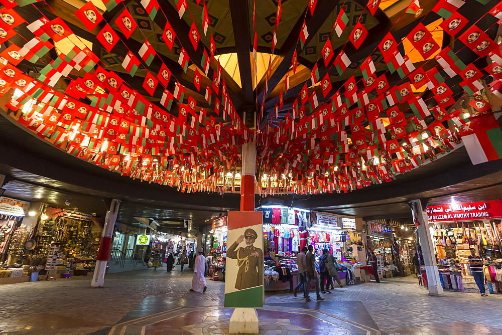 Flags and Sultan's portrait decorate Mutrah Souq for Oman National Day, 18 November, Muscat, Oman, Middle East