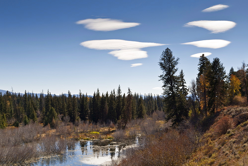 Lenticular clouds over Moose Pond, autumn, Grand Teton National Park, Wyoming, United States of America, North America 