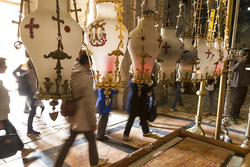 Pilgrims pass the Stone of Unction, Church of the Holy Sepulchre, Old City, Jerusalem, UNESCO World Heritage Site, Israel, Middle East