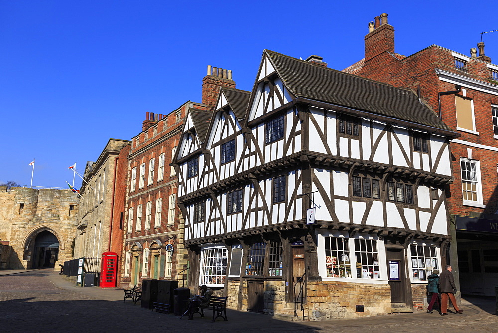 Half-timbered Leigh-Pemberton House, red phone box and Lincoln Castle, Castle Square, Lincoln, Lincolnshire, England, United Kingdom, Europe