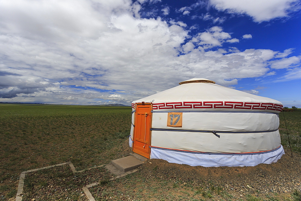 Tourist ger amidst expansive Gobi landscape under a blue sky, Gurvan Saikhan National Park, Tsagaan Tolgol, Mongolia, Central Asia, Asia