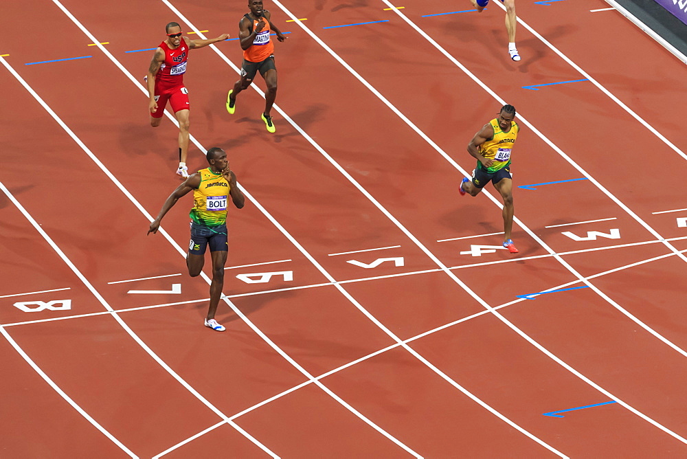 Usain Bolt crosses line with finger to lips, looks at Yohan Blake, Men's 200m final, London 2012, Olympic Games, London, England, United Kingdom, Europe