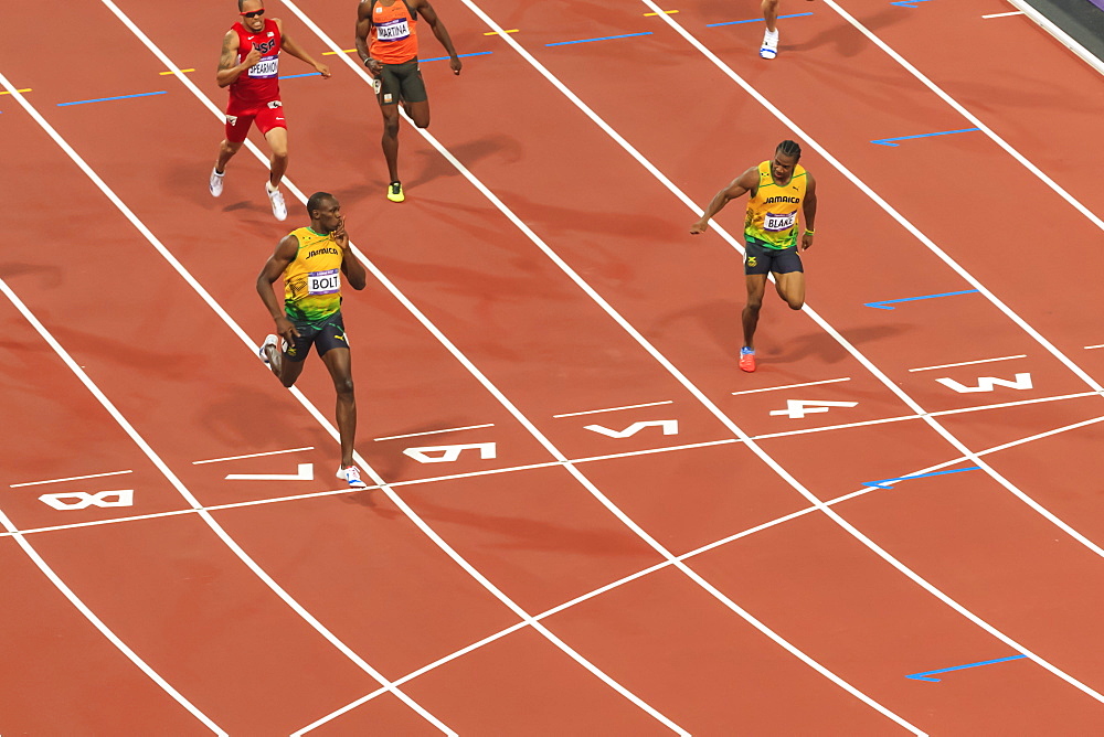 Usain Bolt crosses line with finger to lips, looks at Yohan Blake, Men's 200m final, London 2012, Olympic Games, London, England, United Kingdom, Europe