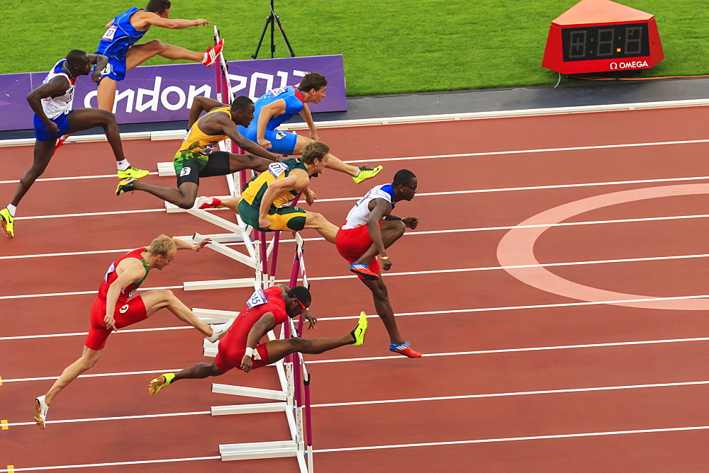 Competitors in Men's 110m hurdles semi-final clear hurdles, London 2012 Stadium, Summer Olympic Games, London, England, United Kingdom, Europe