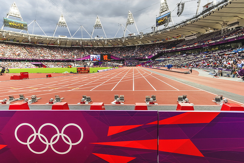 Olympic rings and starting blocks, track side, busy Olympic Stadium pre-session, London 2012, Olympic Games, London, England, United Kingdom, Europe