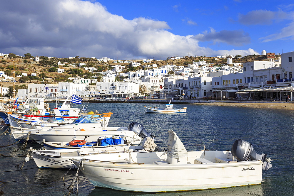 Small boats in harbour, whitewashed Mykonos Town (Chora) with windmills on hillside, Mykonos, Cyclades, Greek Islands, Greece, Europe