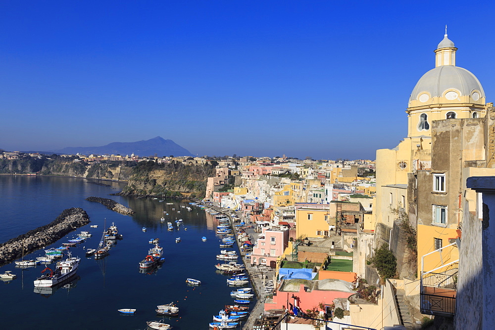 Marina Corricella, pretty fishing village, colourful fishermen's houses, boats and church, Procida Island, Bay of Naples, Campania, Italy, Europe