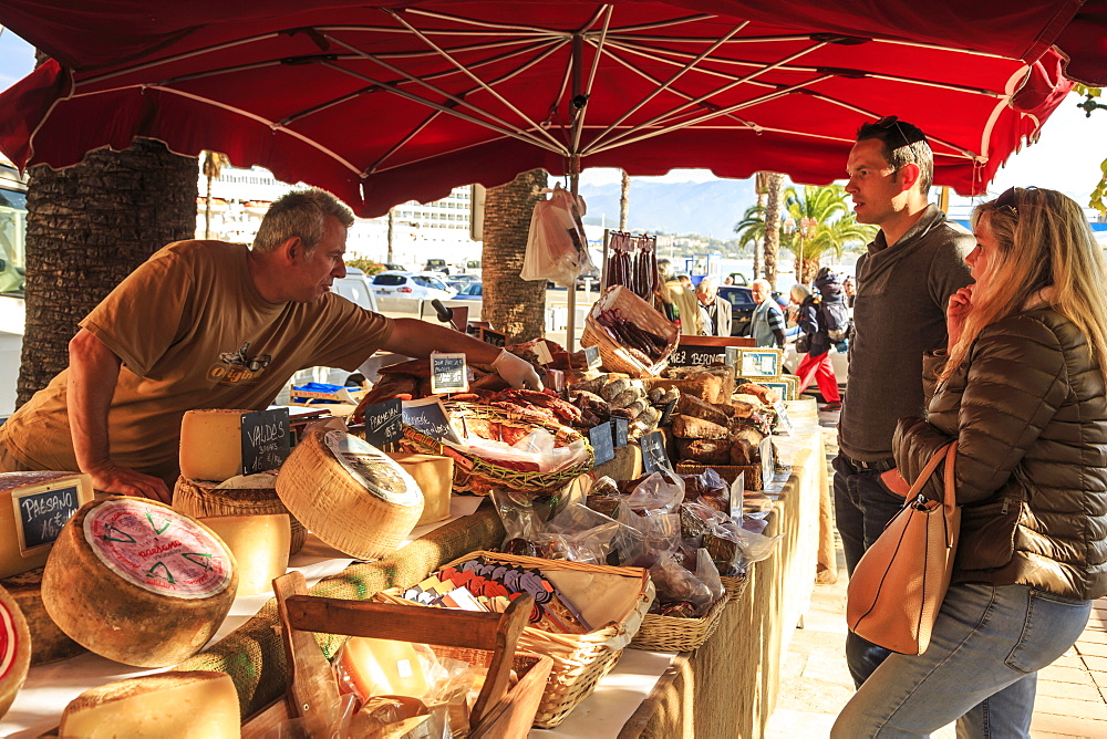 Customers being served at a stall of local meat and cheese in the market, Port of Ajaccio, Island of Corsica, Mediterranean, France, Europe