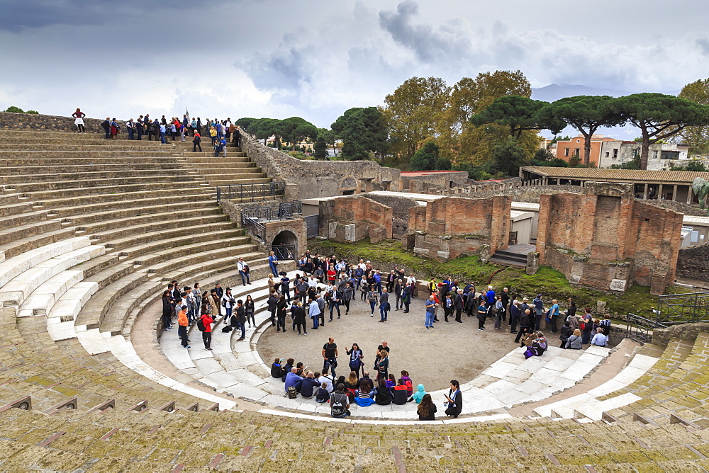 Tour groups in the Large (Grand) Theatre, Roman ruins of Pompeii, UNESCO World Heritage Site, Campania, Italy, Europe