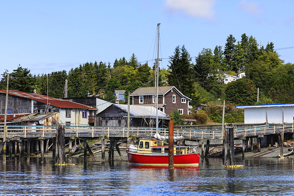 Red yacht, old dock buildings and jetty, Alert Bay, Cormorant Island, Vancouver Island, Inside Passage, British Columbia, Canada, North America