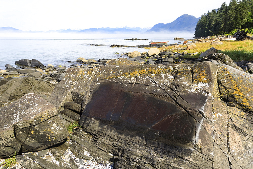 Petroglyphs with mist clearing from beautiful Petroglyph Beach, State Historic Park, Wrangell, Inside Passage, Alaska, United States of America, North America