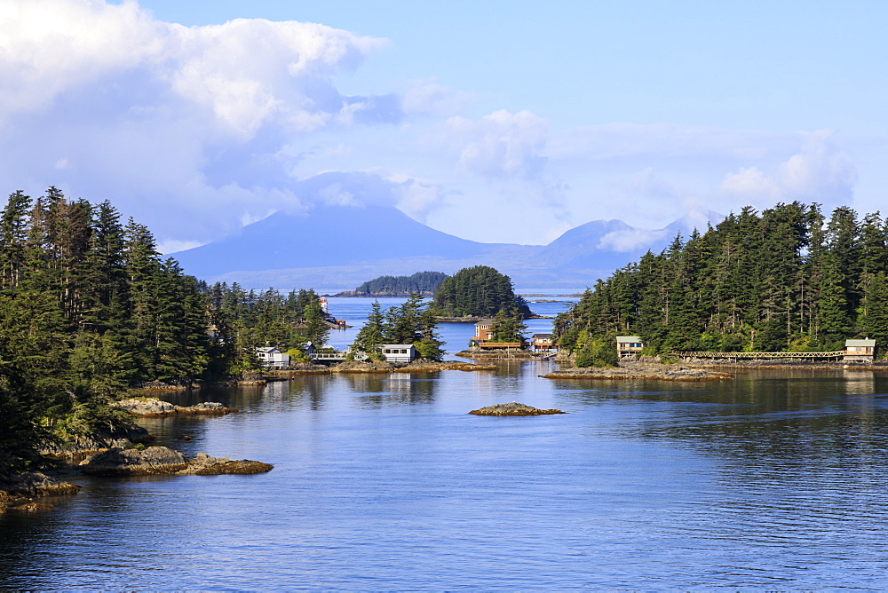 Wooden houses on small forested islands, clearing morning mists, Sitka Sound, Sitka, Northern Panhandle, Southeast Alaska, United States of America, North America