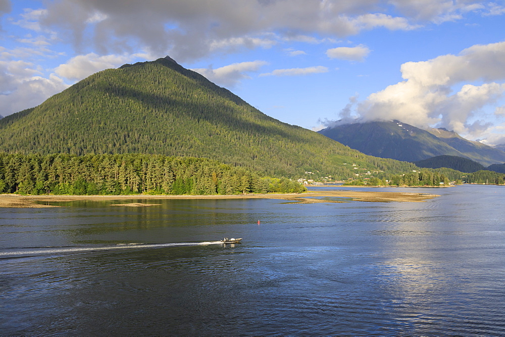 Forested mountains and small boat, from Sitka Sound, rare evening sun, summer, Sitka, Northern Panhandle, Southeast Alaska, United States of America, North America