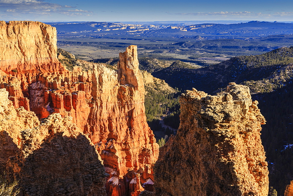 Cliffs and hoodoos lit by late afternoon sun with distant view in winter, Paria View, Bryce Canyon National Park, Utah, United States of America, North America