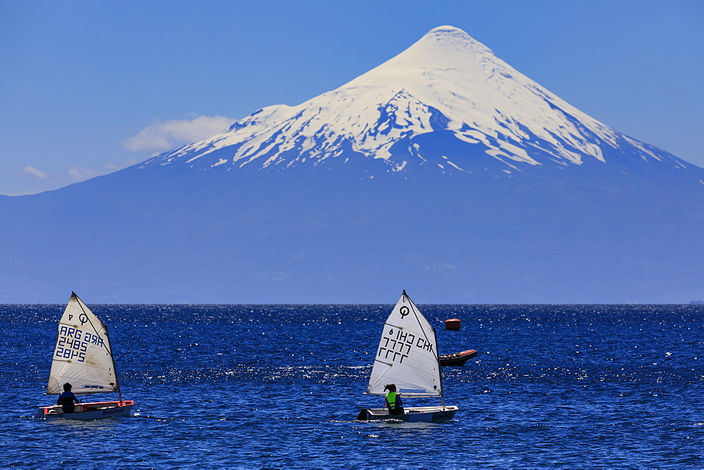 Sailing on Lake Llanquihue, snow-capped Orsono volcano, from Puerto Varas, Lakes District, Chile, South America