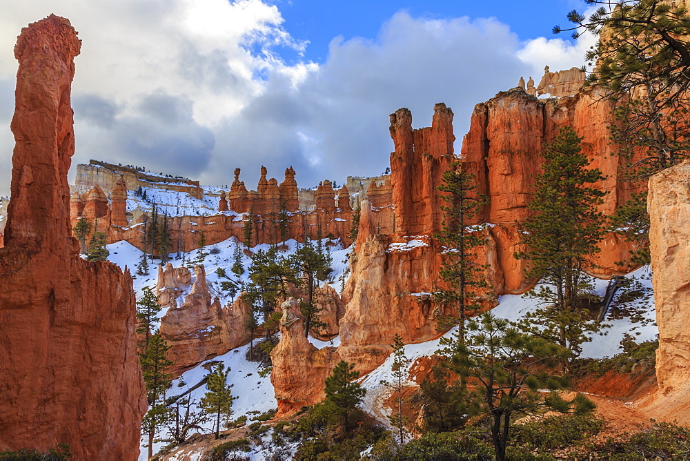 Hoodoos and snow with layers of cloud, from Peekaboo Loop Trail in winter, Bryce Canyon National Park, Utah, United States of America, North America